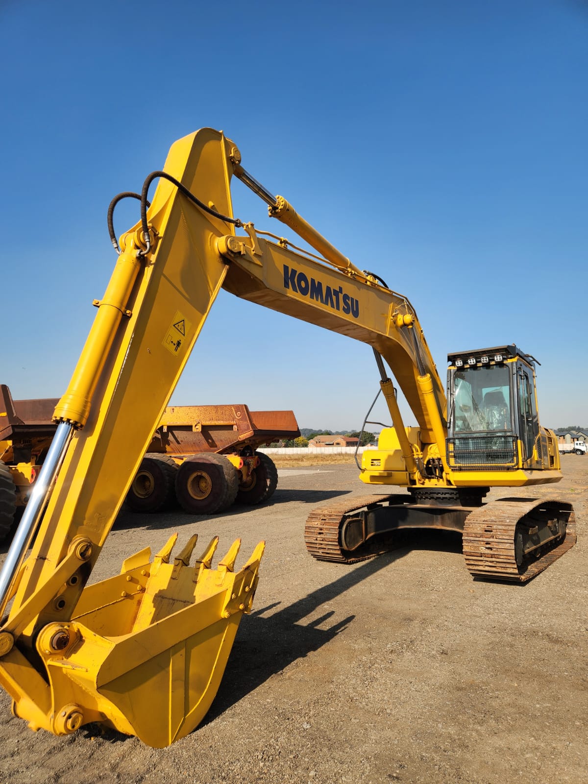 Komatsu tracked excavator with bucket raised