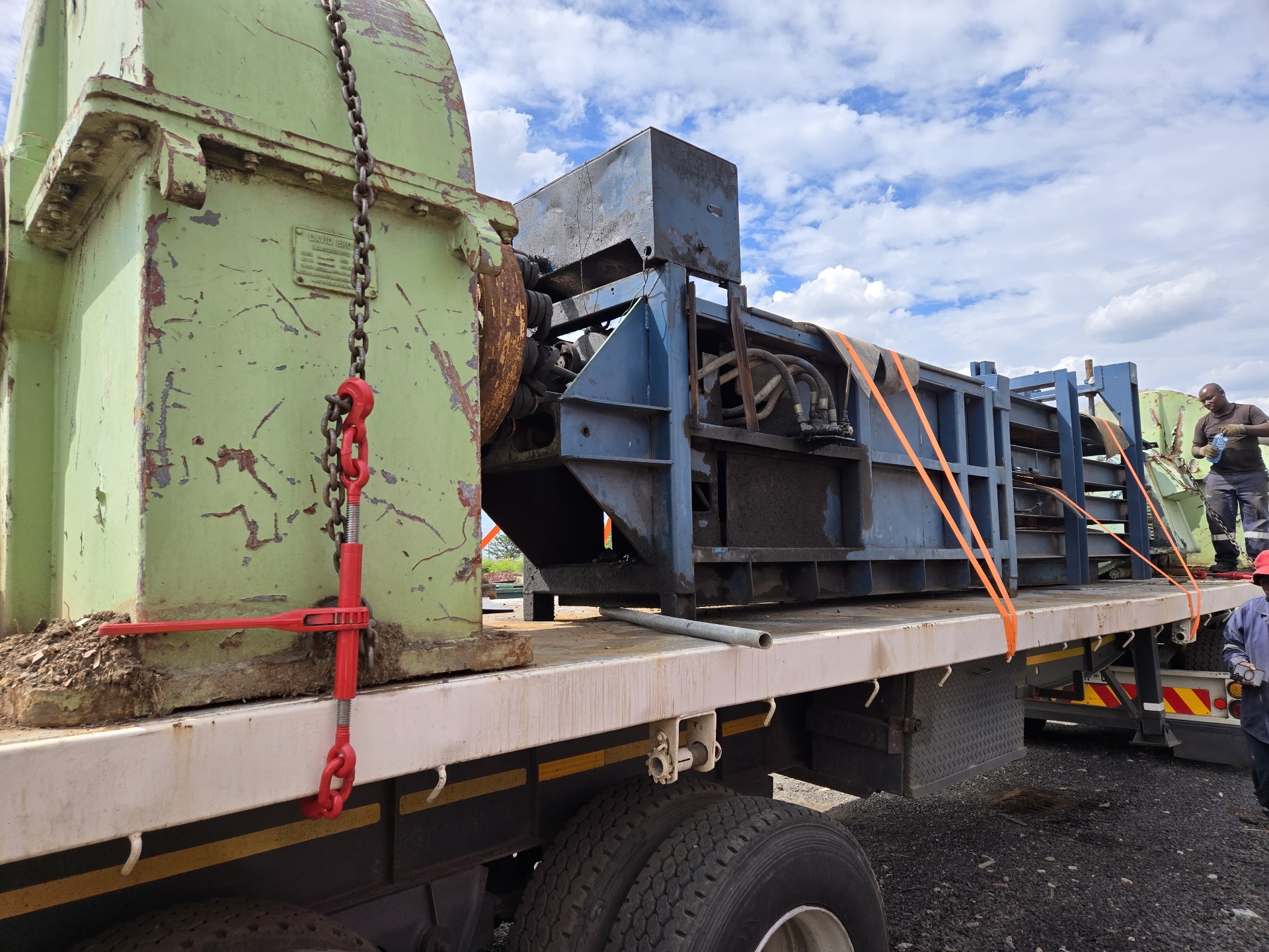 Crusher plant and gearbox chained down on a flatbed truck