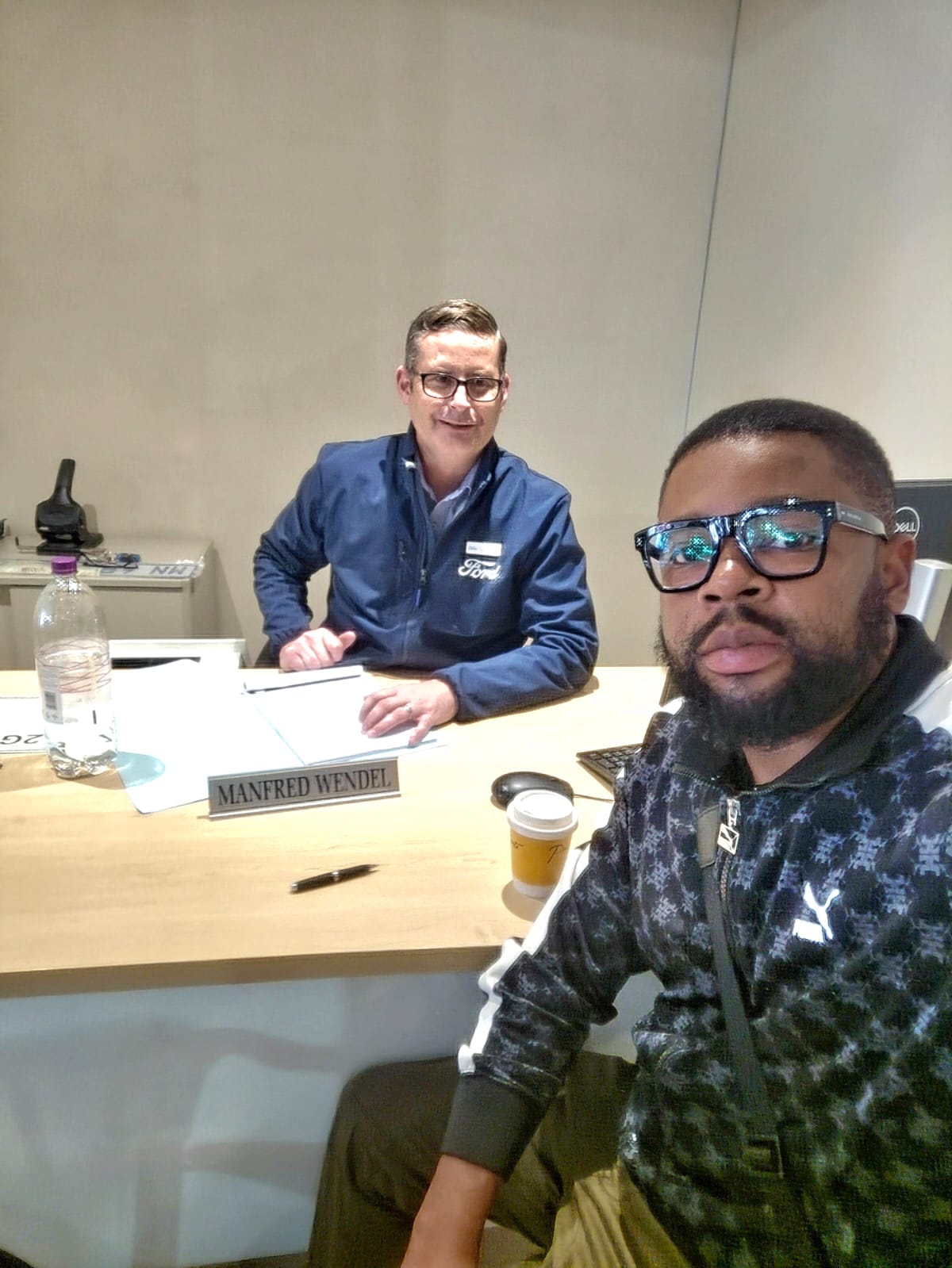 Scott Sandton sourcing meeting at a Ford dealership