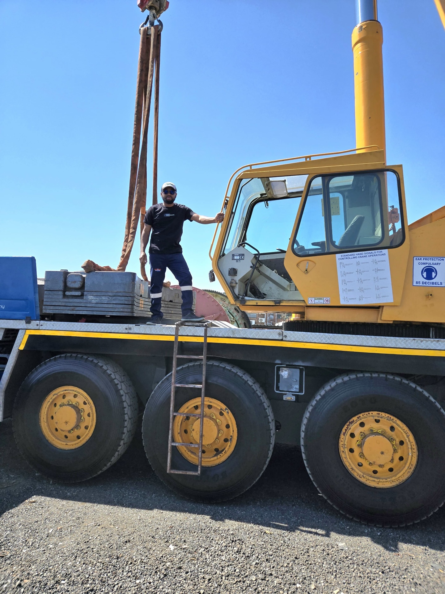 Crane lifting mining equipment at the yard