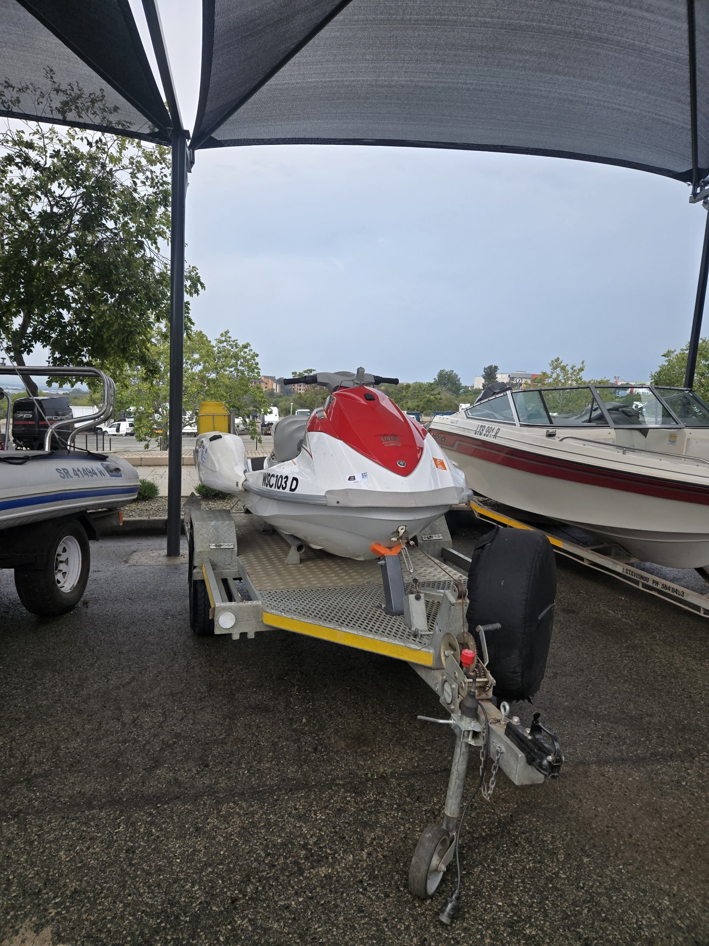 Front view of the jet ski and trailer at the marine yard