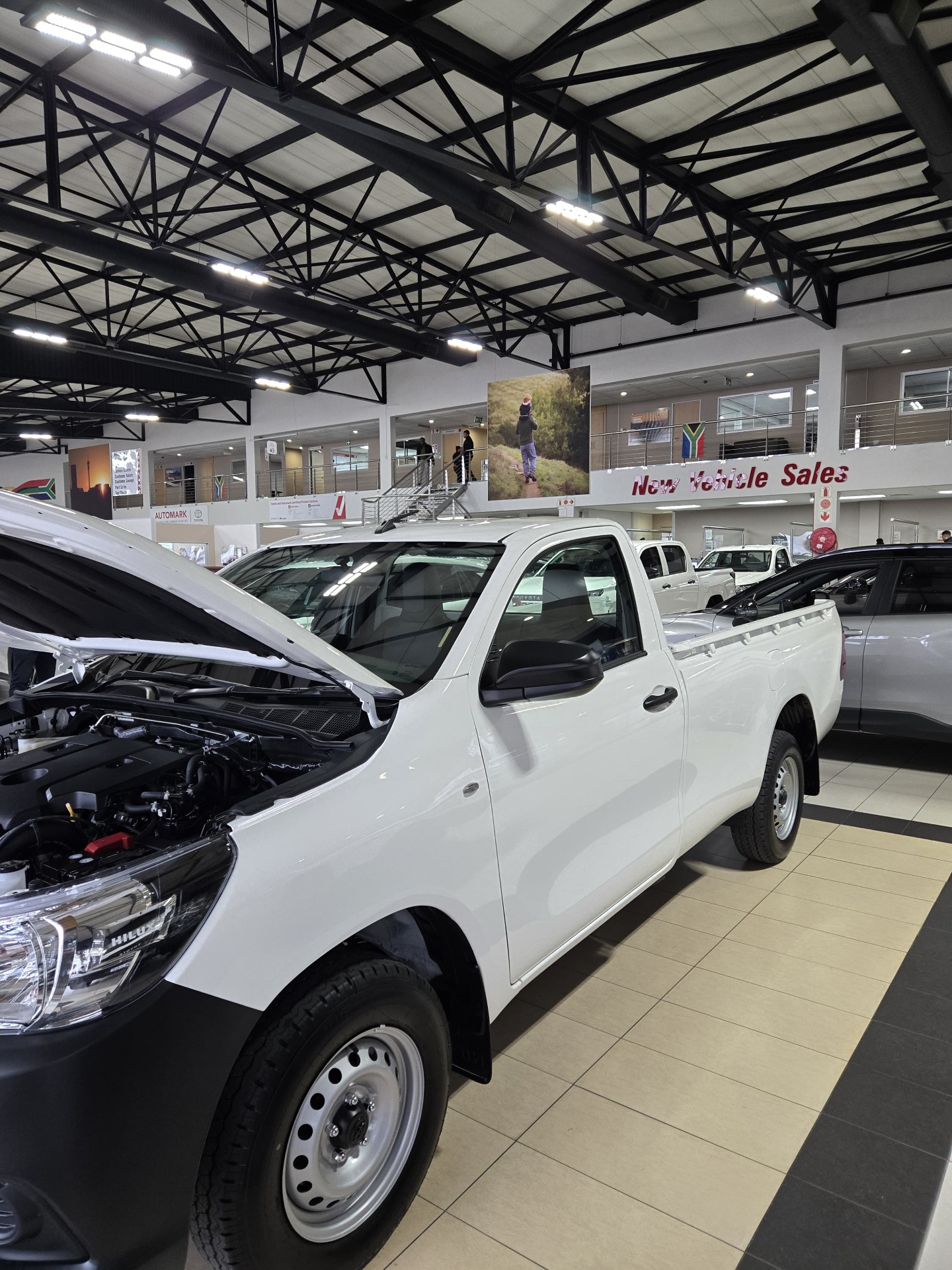 Toyota Hilux with the engine bay open during inspection